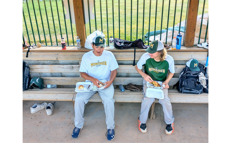 Enjoying a chicken in the dugout
